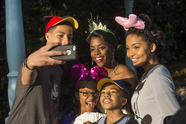 (L-R) Actors Marcus Scribner, Marsai Martin, Miles Brown and Yara Shahidi, from the cast of the ABC series "black-ish," take a selfie March 28, 2015 with Princess Tiana at Magic Kingdom in Lake Buena Vista, Fla. The four visited Walt Disney World Resort with their families to kick off their summer break and celebrate the success of the show's first season. (Mariah Wild, photographer)