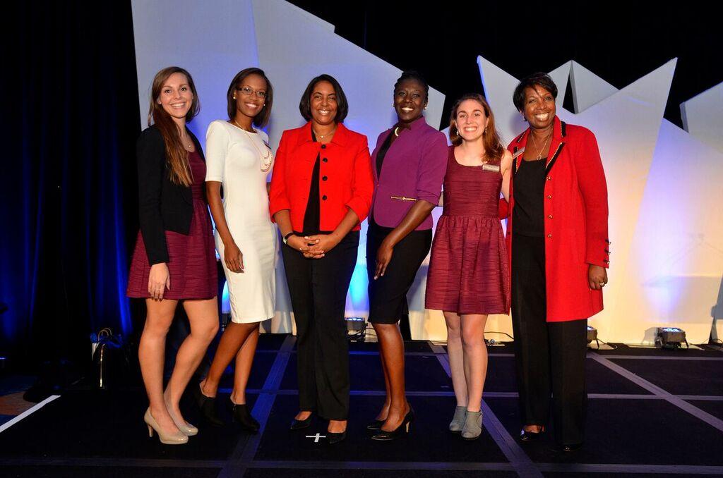 Sandy D. Welfare, Women in Technology Executive Director (third left) with her team
