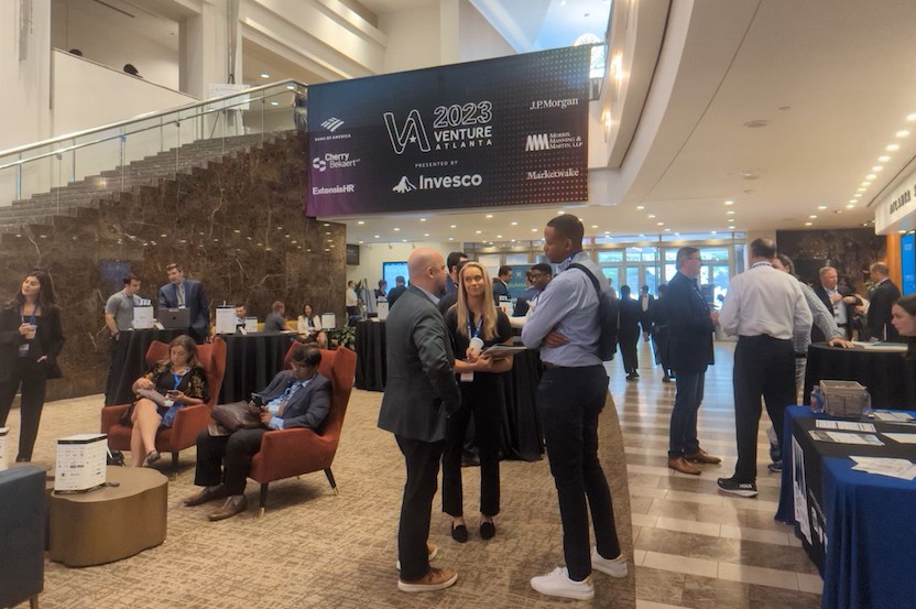 Attendees at Venture Atlanta networking in the lobby