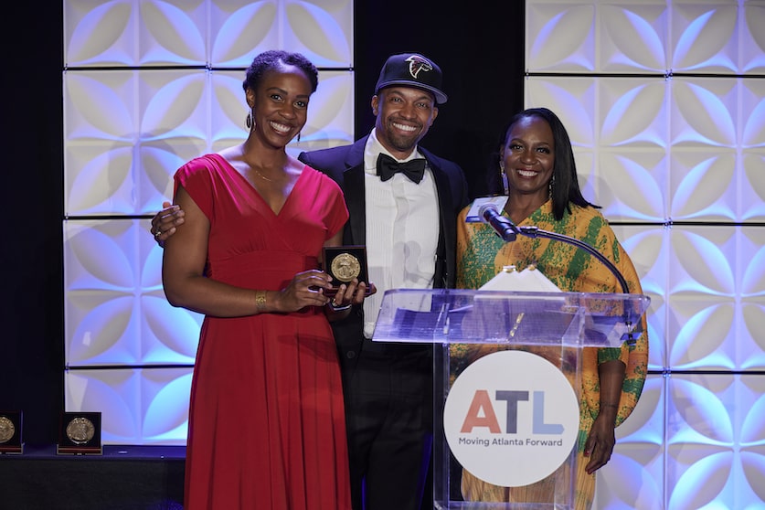 Blayne Alexander and Burunda Prince accepting the Lifetime Award on behalf on RICE's Jay Bailey