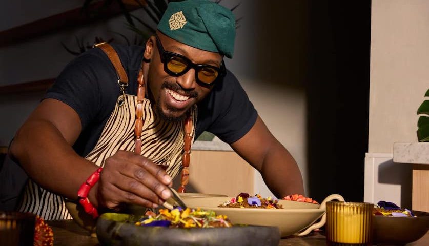 Chef Tolu Eros plating jollof rice