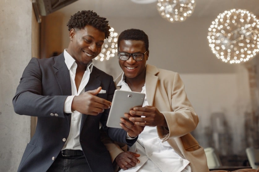 canva stock image_men looking at ipad
