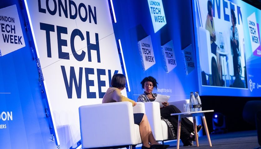 UrbanGeekz CEO Kunbi Tinuoye moderating a panel discussion at London Tech Week with Tara McGeehan, President of CGI UK and Australia