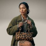 Model showcasing the LVCY PEARL modular handbag system