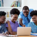 students using a laptop Source: Canva