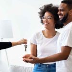 Agent Giving Key To African Couple, New House Owners Indoor stock Image Canva
